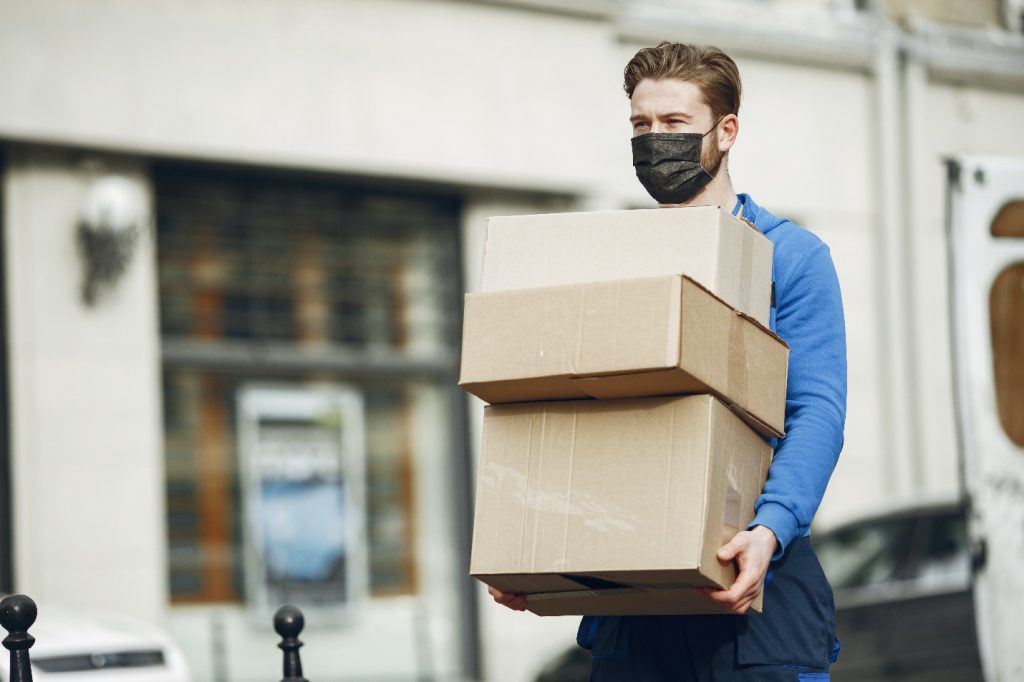 Delivery Man Carrying Cardboard Boxes