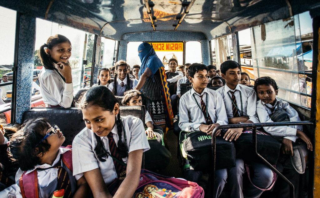 Focus Photography of Children on a School Bus